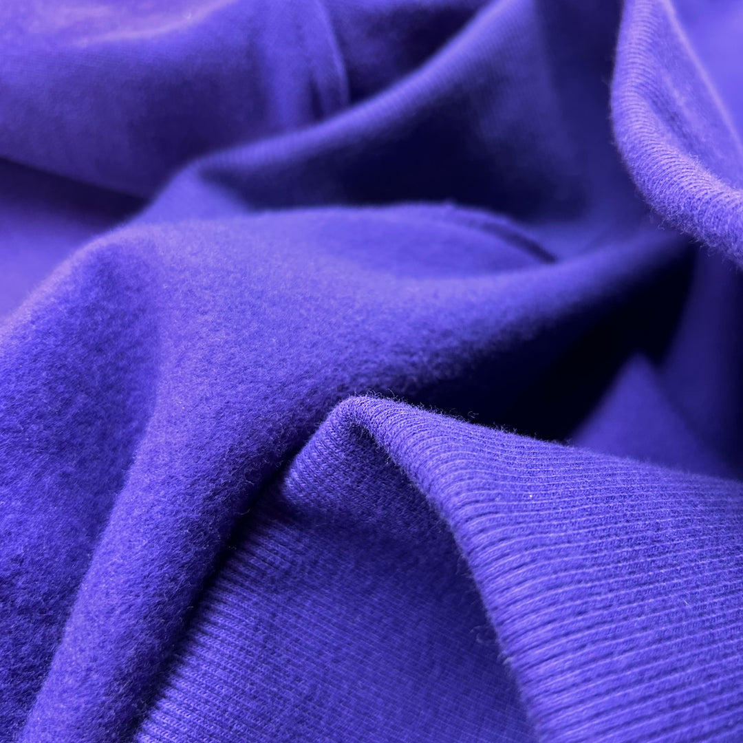 Soft organic cotton buttery-soft, cloud-like, cosy, ultra-soft, plush, brushed cotton, fleece-lined, smooth, breathable.
