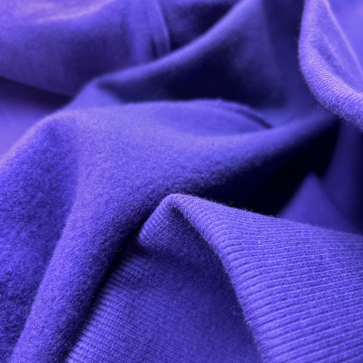 Soft organic cotton buttery-soft, cloud-like, cosy, ultra-soft, plush, brushed cotton, fleece-lined, smooth, breathable.
