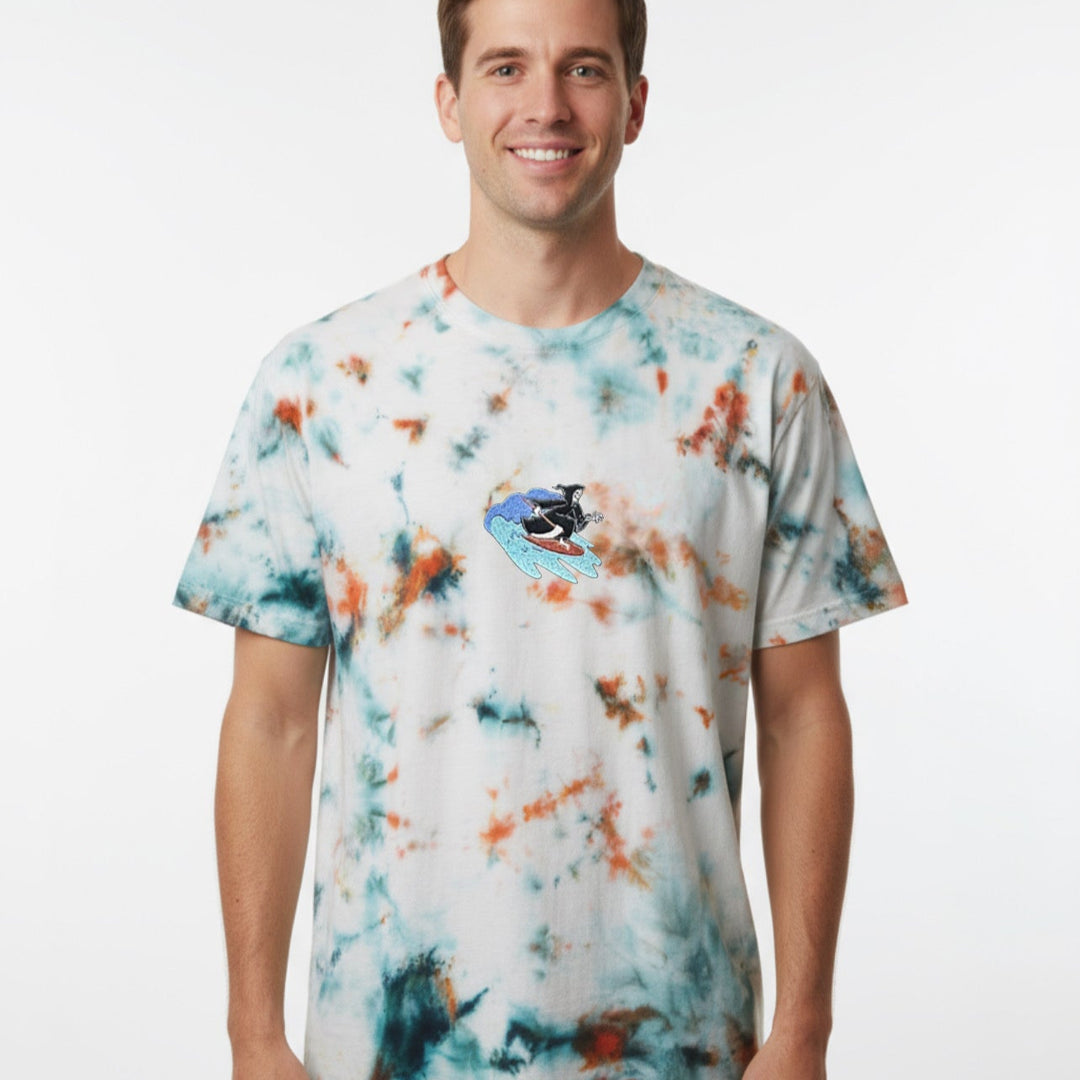 Man wearing a tie-dye t-shirt with a colorful design on a white background