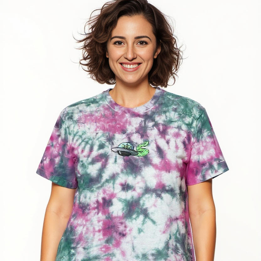 Woman wearing a tie-dye t-shirt with a logo on a white background