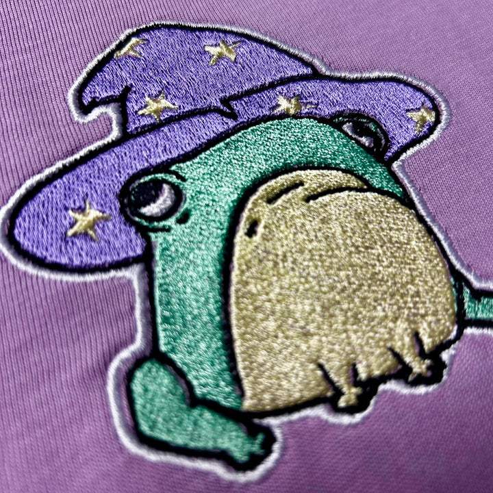 Embroidered Frog with Wizard Hat on. 