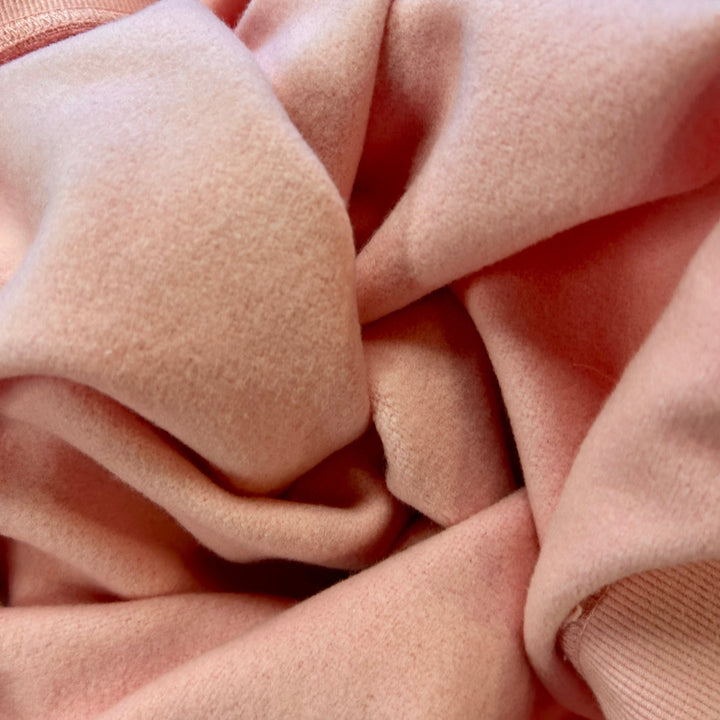 Close-up of pink fabric with a soft texture